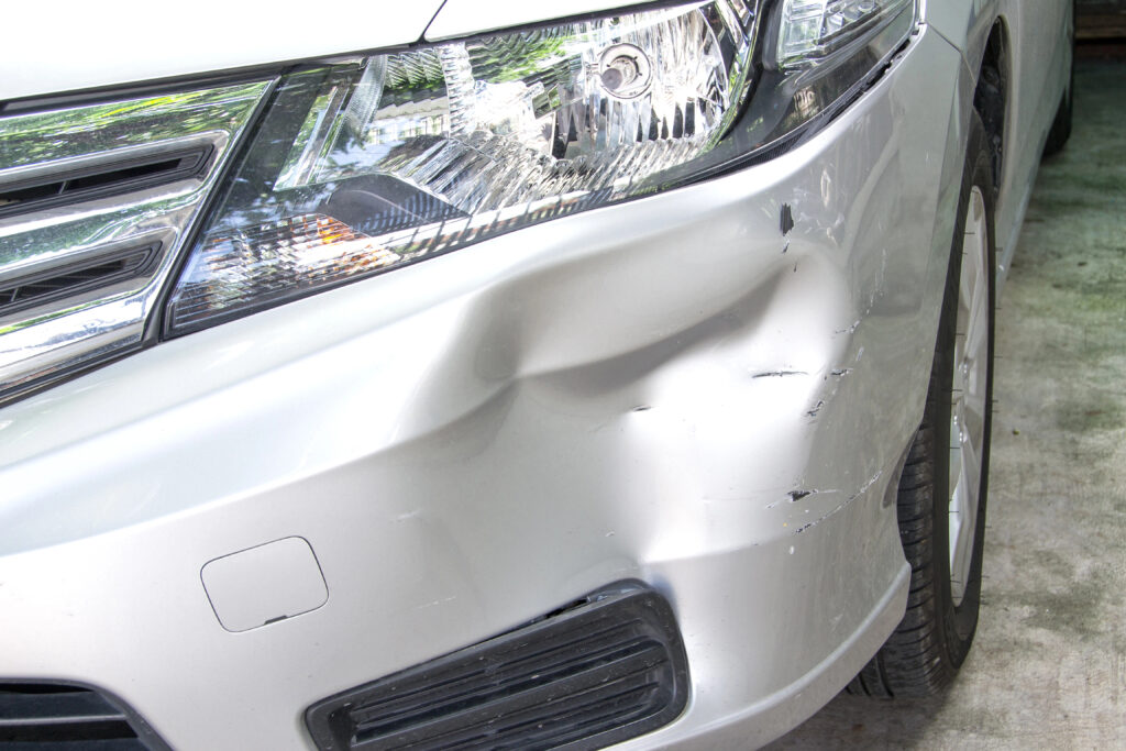 vehicle with front bumper dent
